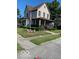 Charming two-story home with landscaped yard, front porch, and American flag at 214 S Howard St, Oxford, IN 47971