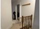Bright hallway featuring classic wooden accents and a glimpse into adjacent rooms at 214 S Howard St, Oxford, IN 47971