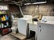 Functional laundry area with washer, dryer, and utility sink at 214 S Howard St, Oxford, IN 47971