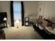 Bright living room with neutral carpet and a large window, creating a cozy atmosphere at 214 S Howard St, Oxford, IN 47971