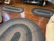 Hardwood floors and decorative oval rugs accent this room at 214 S Howard St, Oxford, IN 47971