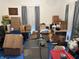 Cluttered room with boxes and furniture, offering potential for customization at 214 S Howard St, Oxford, IN 47971