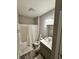 Bathroom featuring a shower-tub combo with a white curtain, toilet, and a single sink vanity at 253 Darrough Dr, Greenwood, IN 46143