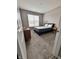 Bedroom with carpet, a blue bed frame, a dresser, and two bedside tables with lamps at 253 Darrough Dr, Greenwood, IN 46143