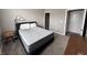 Neutral bedroom with carpet, a blue bed frame, a dresser, and two bedside tables with lamps at 253 Darrough Dr, Greenwood, IN 46143