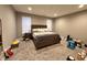 Spacious bedroom with carpet, a wooden bed frame, two windows, and a nightstand with lamps at 253 Darrough Dr, Greenwood, IN 46143