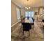 Elegant dining room with a large wooden table, seating for ten, and a chandelier at 253 Darrough Dr, Greenwood, IN 46143