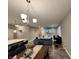 Open-concept living space with eat in bar, perfect for entertaining at 253 Darrough Dr, Greenwood, IN 46143