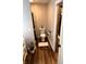 Bright bathroom features a toilet, shower and closet, all set against modern wood-look flooring at 2650 W State Road 252, Flat Rock, IN 47234