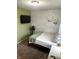 Inviting bedroom with a modern accent wall and comfortable furnishings at 2650 W State Road 252, Flat Rock, IN 47234