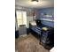 Bedroom with bunk bed, grey walls, window, and decor at 2650 W State Road 252, Flat Rock, IN 47234