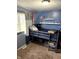 Bedroom with bunk bed, grey walls, window, and decor at 2650 W State Road 252, Flat Rock, IN 47234