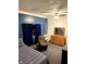 Comfortable bedroom with a cozy seating area and ample closet space at 2650 W State Road 252, Flat Rock, IN 47234