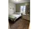 Cozy bedroom with a neutral color palette and ample natural light at 2650 W State Road 252, Flat Rock, IN 47234