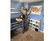 Bedroom with bunk bed, shelves with toys, stuffed animal hammock, and a US map at 2650 W State Road 252, Flat Rock, IN 47234