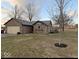 Charming brick home featuring a detached garage and a well-maintained lawn at 2650 W State Road 252, Flat Rock, IN 47234