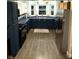 Well-lit kitchen featuring updated appliances and plenty of counter space at 2650 W State Road 252, Flat Rock, IN 47234
