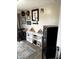 Living room featuring white shelving units, sports memorabilia and a secure safe at 2650 W State Road 252, Flat Rock, IN 47234