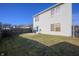 A spacious backyard with a patio and a well-maintained lawn, perfect for outdoor activities and relaxation at 411 Red Tail Ln, Indianapolis, IN 46241