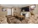 Living room showcases an ornate coffee table and an entertainment center with fireplace at 411 Red Tail Ln, Indianapolis, IN 46241