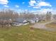 Aerial view of a well-maintained home with sprawling lawn and charming patio set at 4131 N County Road 500 E, Danville, IN 46122