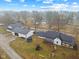 Aerial view of home featuring an outdoor playground, trampoline, and covered porch at 4131 N County Road 500 E, Danville, IN 46122