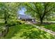 The outdoor space has a fire pit, shade trees, a patio, and a brick path for easy accessibility at 4131 N County Road 500 E, Danville, IN 46122