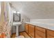 Cozy bathroom with a pedestal sink, vanity with marble countertop, and shower with floral curtain at 4131 N County Road 500 E, Danville, IN 46122
