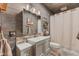 The bathroom has shiplap walls, a shower and a vanity at 4131 N County Road 500 E, Danville, IN 46122