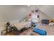 Charming attic bedroom featuring two beds, sloped ceilings, hardwood floors, and colorful decorations for a cozy retreat at 4131 N County Road 500 E, Danville, IN 46122