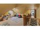 Attic bedroom featuring sloped ceilings, playful decor, and a cozy atmosphere, carpet, with an adjacent room at 4131 N County Road 500 E, Danville, IN 46122