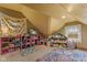 Bright attic bedroom with charming decor and organized storage solutions, filled with natural light and playful accents at 4131 N County Road 500 E, Danville, IN 46122