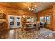 Elegant dining room with a large wooden table, chandelier, and view to the exterior at 4131 N County Road 500 E, Danville, IN 46122