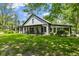 Charming home featuring a well-manicured lawn and covered porch, blending rural appeal at 4131 N County Road 500 E, Danville, IN 46122