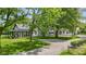 Charming home featuring a white exterior, metal roof, and well-maintained landscaping at 4131 N County Road 500 E, Danville, IN 46122