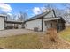 Exterior of home featuring a covered patio, firepit, and large air conditioning unit at 4131 N County Road 500 E, Danville, IN 46122