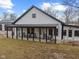 Quaint home featuring a covered front porch with rocking chairs, perfect for relaxing at 4131 N County Road 500 E, Danville, IN 46122