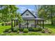 Inviting covered front porch with black accents, perfect for relaxing outdoors at 4131 N County Road 500 E, Danville, IN 46122