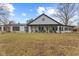 Charming home with a welcoming front porch and rows of rocking chairs for relaxing at 4131 N County Road 500 E, Danville, IN 46122