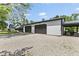 Spacious detached garage with black doors, connected to the house with patio at 4131 N County Road 500 E, Danville, IN 46122