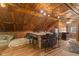 The kitchenette offers wood-look flooring, a unique paneled ceiling, a countertop with barstool seating, and a comfortable sofa at 4131 N County Road 500 E, Danville, IN 46122