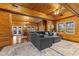 Open living room with wood paneling, natural light, and a view of the dining area at 4131 N County Road 500 E, Danville, IN 46122
