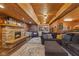 Large living room with wood panels, a fireplace, and plenty of seating space at 4131 N County Road 500 E, Danville, IN 46122