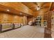 Spacious room with wood paneling, carpeted floors, and plenty of storage for toys at 4131 N County Road 500 E, Danville, IN 46122