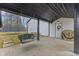 Covered patio with an outdoor swing, offering a cozy and sheltered space for relaxation and outdoor enjoyment at 4131 N County Road 500 E, Danville, IN 46122
