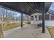 Covered patio with swing, overlooking a yard with a fire pit, perfect for outdoor entertaining and relaxation at 4131 N County Road 500 E, Danville, IN 46122