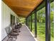 Inviting porch with rocking chairs and wood ceiling, perfect for relaxing at 4131 N County Road 500 E, Danville, IN 46122
