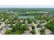 Beautiful aerial view of houses nestled in a lush, green neighborhood near a scenic lake at 5208 Clear Lake Ct, Carmel, IN 46033