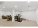 Finished basement area featuring exercise equipment, recessed lighting, and ample open space at 5208 Clear Lake Ct, Carmel, IN 46033