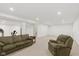 Spacious carpeted basement with rec area and exercise equipment at 5208 Clear Lake Ct, Carmel, IN 46033